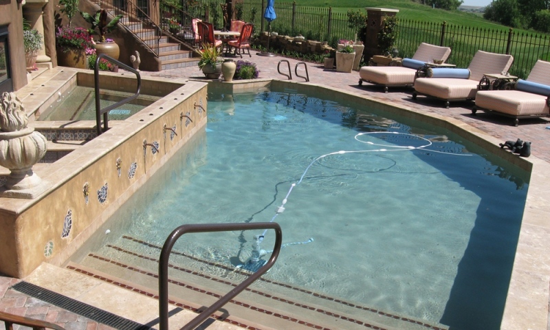 Pool and spa with water feature