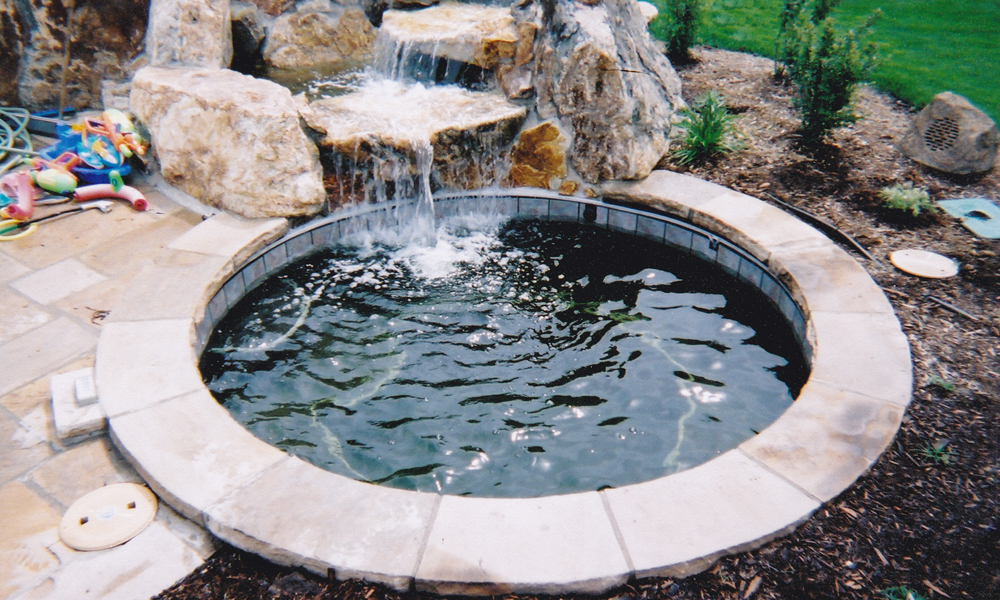 spa with rock water feature